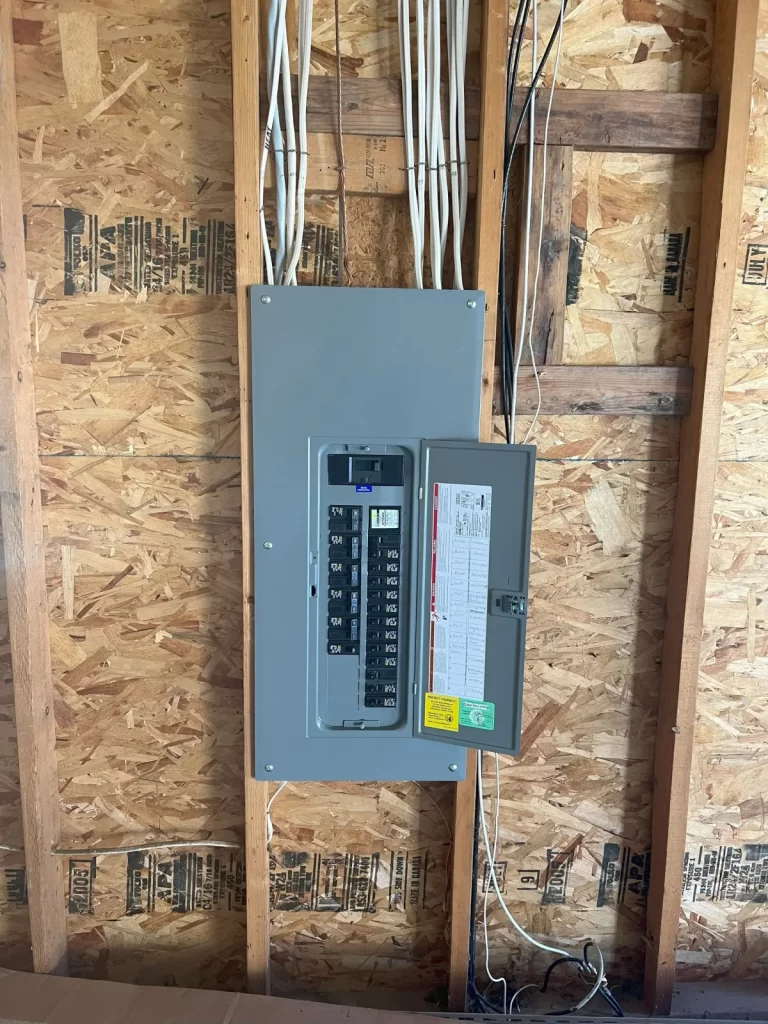 an electrical box is hanging on a wooden wall new replacement by mauro electric in Seattle WA